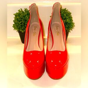 Chase and Chloe red patent high heel platform pumps. Size 10.